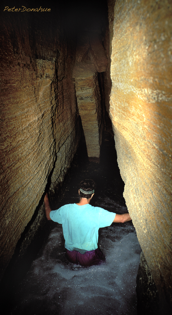 Kathy Miller deep in the Thunder River cave, photo by Peter Donahue